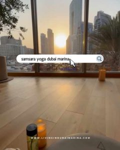 Yoga class in session at Samsara Yoga Dubai Marina with branded props and natural lighting.
